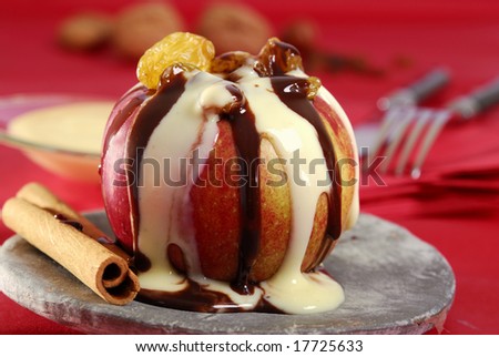 baked apple with chocolate sauce and vanilla sauce