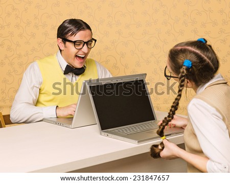 Young nerds sitting at the desk