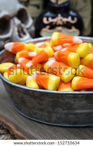 Halloween candy buffet of candy corn in yellow, orange and white at a Halloweeen party.