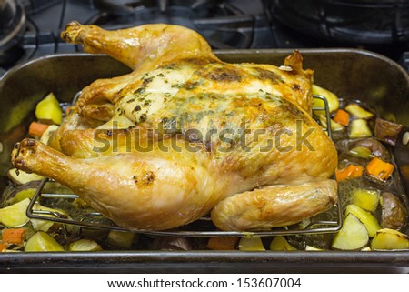 Oven roasted herb marinated chicken with roasted vegetables.