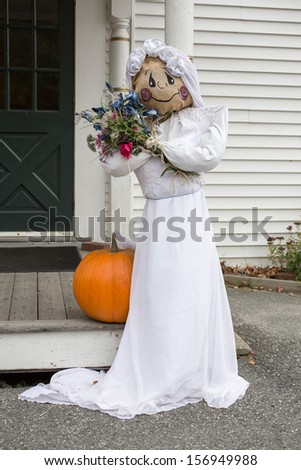 A scarecrow bride at the church ready for the Halloween wedding.