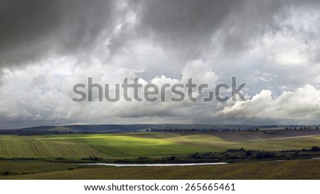 Farmland and lake during bad weather