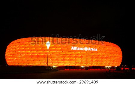 MUNICH – CIRCA SEPT 2008 : Colorful illumination of Allianz Arena, FIFA 2006 World Cup Stadium circa September 2008 in Munich. The stadium has nicknames such as UFO, rubber dinghy, and lifebelt.