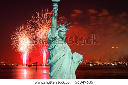 The Statue of Liberty and July 4th fireworks over Hudson River