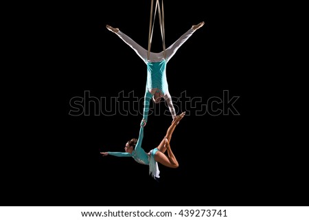 Similar – Image, Stock Photo Graceful acrobat performs with hoop on beach