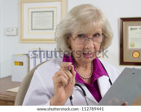A woman doctor sitting at her desk appears to be giving advice on a medical subject.