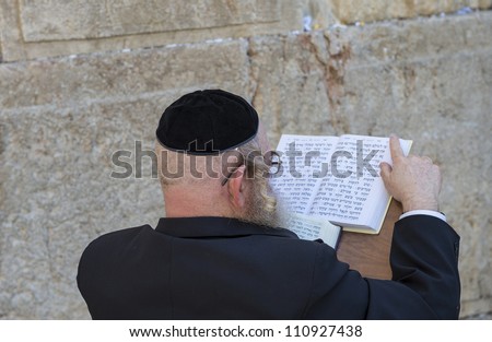 JERUSALEM - JULY 29: Jewish man prays in the Wailing wall during the Jewish holy day of Tisha B'av, on July 29, 2012 in old Jerusalem, Israel
