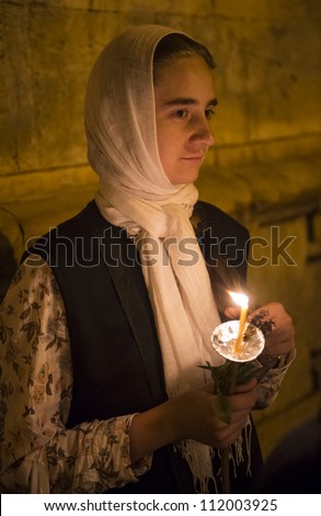 JERUSALEM - AUGUST 25 : Unidentified pilgrim take part in a candle procession as part of the feast of the Assumption of the Virgin Mary on August 25 2012 in old Jerusalem Israel