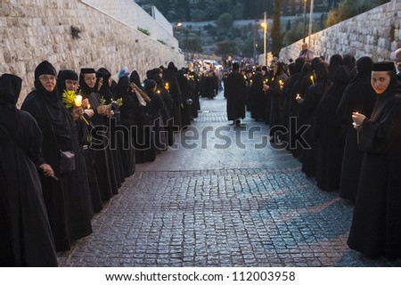 JERUSALEM - AUGUST 25 : Unidentified nuns take part in a candle procession as part of the feast of the Assumption of the Virgin Mary on August 25 2012 in old Jerusalem Israel