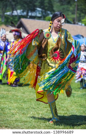 MARIPOSA ,USA - MAY 11 : Unidentified Native Indian dancer takes part at the Mariposa 20th annual Pow Wow in California , USA on May 11 2013 ,Pow wow is native American cultural gathernig event.