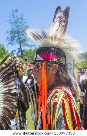 MARIPOSA ,USA - MAY 11 : An unidentified Native Indian boy takes part at the Mariposa 20th annual Pow Wow in California , USA on May 11 2013 ,Pow wow is native American cultural gathernig event.
