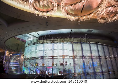 LAS VEGAS - FEB 26 : The Chandelier Bar at the Cosmopolitan Hotel & Casino in Las Vegas on February 26 2013. This tri-level chandelier encases the hotels 3 bars in illuminated crystals.