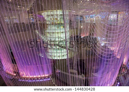 LAS VEGAS - FEB 26 : The Chandelier Bar at the Cosmopolitan Hotel & Casino in Las Vegas on February 26 2013. This tri-level chandelier encases the hotels 3 bars in illuminated crystals.