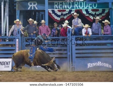RENO , USA - JUNE 30 : Cowboy Participant in a Bull riding Competition at the Reno Rodeo  a Professional Rodeo held in Reno Nevada , USA on June 30 2013