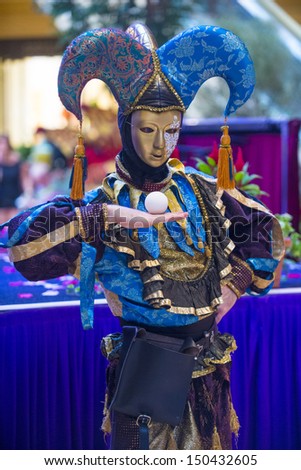 LAS VEGAS - JULY 16 : Performer with Venetian style mask at the Carnevale experience festival in the Venetian Hotel in Las Vegas on July 16, 2013.