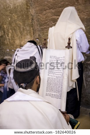JERUSALEM - JULY 29 : Jewish men prays in the Wailing wall during the Jewish holyday of Tisha B\'av , on July 29 2012 in old Jerusalem , Israel