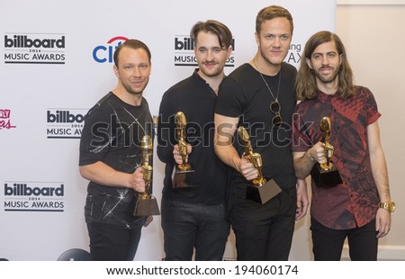 LAS VEGAS - MAY 18 : Members of the alternative rock band Imagine Dragons attend the 2014 Billboard Music Awards press room at the MGM Grand Garden Arena on May 18 , 2014 in Las Vegas.