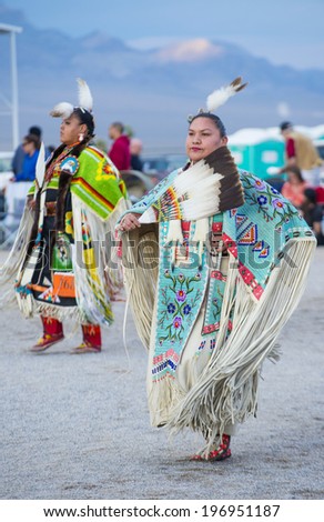 LAS VEGAS - MAY 24 : Native American women takes part at the 25th Annual Paiute Tribe Pow Wow on May 24 , 2014 in Las Vegas Nevada. Pow wow is native American cultural gathernig event.