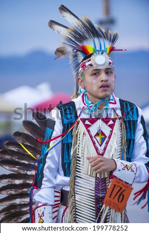 LAS VEGAS - MAY 24 : Native American man takes part at the 25th Annual Paiute Tribe Pow Wow on May 24 , 2014 in Las Vegas Nevada. Pow wow is native American cultural gathernig event.