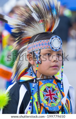 LAS VEGAS - MAY 24 : Native American boy takes part at the 25th Annual Paiute Tribe Pow Wow on May 24 , 2014 in Las Vegas Nevada. Pow wow is native American cultural gathernig event.