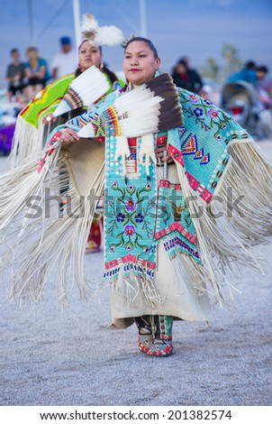 LAS VEGAS - MAY 24 : Native American women takes part at the 25th Annual Paiute Tribe Pow Wow on May 24 , 2014 in Las Vegas Nevada. Pow wow is native American cultural gathernig event.