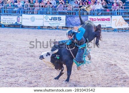 LAS VEGAS - MAY 17 : Cowboy Participating in a Bull riding Competition at the Helldorado days Rodeo , A professional Rodeo held in Las Vegas , Nevada on May 17 , 2015