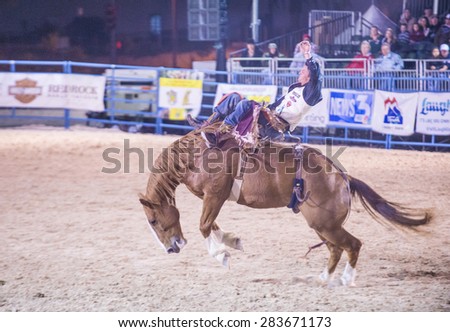 LAS VEGAS - MAY 16 : Cowboy Participating in a Bucking Horse Competition at the Helldorado days Rodeo , A Professional Rodeo held in Las Vegas on May 16 2015