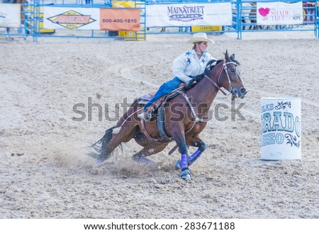 LAS VEGAS - MAY 17 : Cowgirl Participating in a Barrel racing competition at the Helldorado Days Rodeo , A professional rodeo held in Las Vegas , Nevada on May 17 2015