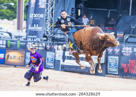 LAS VEGAS - MAY 23 : Number one Bull rider in the world  Joao Ricardo Vieira Participating in a Bull riding Competition at the Las Cowboy Standing , a PBR cometition held in Las Vegas on May 23 2015
