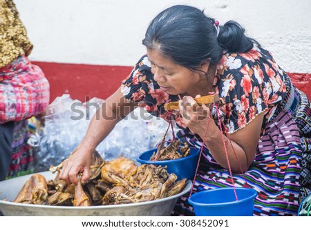 CHICHICASTENANGO , GUATEMALA - JULY 26 : Guatemalan woman Sell fried chicken in the Chichicastenango Market on July 26 2015. This native market is the most colorful in Central America