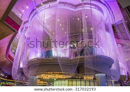 LAS VEGAS - SEP 03 : The Chandelier Bar at the Cosmopolitan Hotel & Casino in Las Vegas on September 03 2015. This tri-level chandelier encases the hotels 3 bars in illuminated crystals.