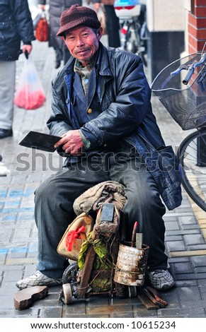 Chinese worker in Shanghai street