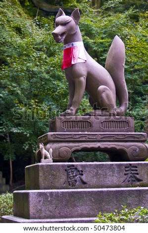 Fox statue in Fushimi Inari-taisha Shrine in Kyoto Japan - The fox is seen as the messenger of the god of grain food