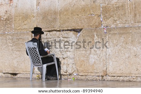 Orthodox Jew prays in the Westren wall an Important Jewish religious site located in the Old City of Jerusalem