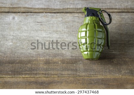 Hand grenade M26A1 model on wood background