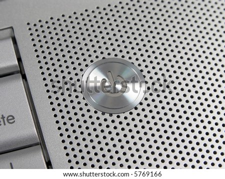 silver laptop On button circle detail view