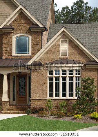 Luxury Model Home Exterior with front door bay window
