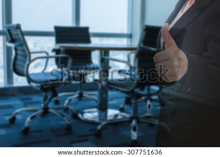 business woman thumb up show with meeting room focus Blur background