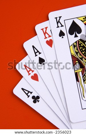 A full house poker game on red background.