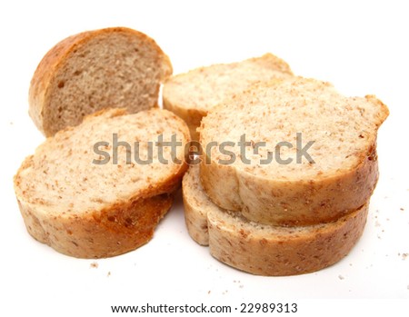 cutted long loaf with bran on the white background