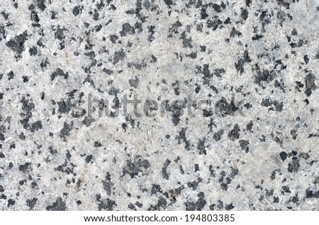 Gray with black granite inserts. Natural texture
