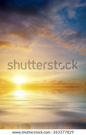 Soft sunset over the sea. The sun sets over the horizon. romantic composition