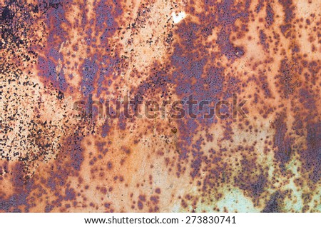 Part of the old-painted iron sheet with rust patches. textural composition