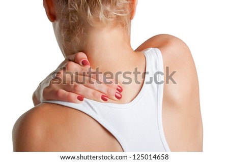 Young woman with pain in the back of her neck, isolated in a white background