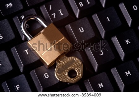 A padlock on top a computer keyboard to represent the concept of computer security