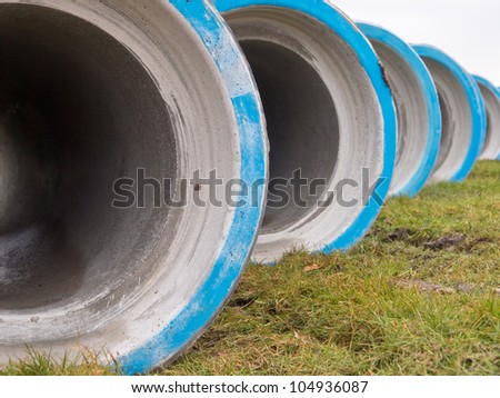 Concrete sewage construction pipes on a building site