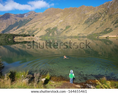 Woman Swimming in the Serene Waters of Moke Lake, Queenstown, New Zealand