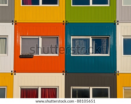 colorful cargo containers used as home by students to  solve housing problem
