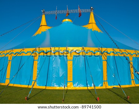 Close up of a  blue and yellow big top circus tent
