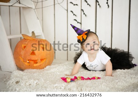 Girl with Down syndrome eating candy on a holiday Halloween